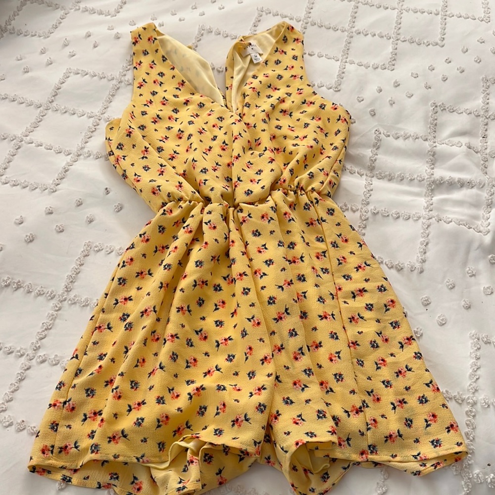 Size medium yellow romper with pink and blue flowers